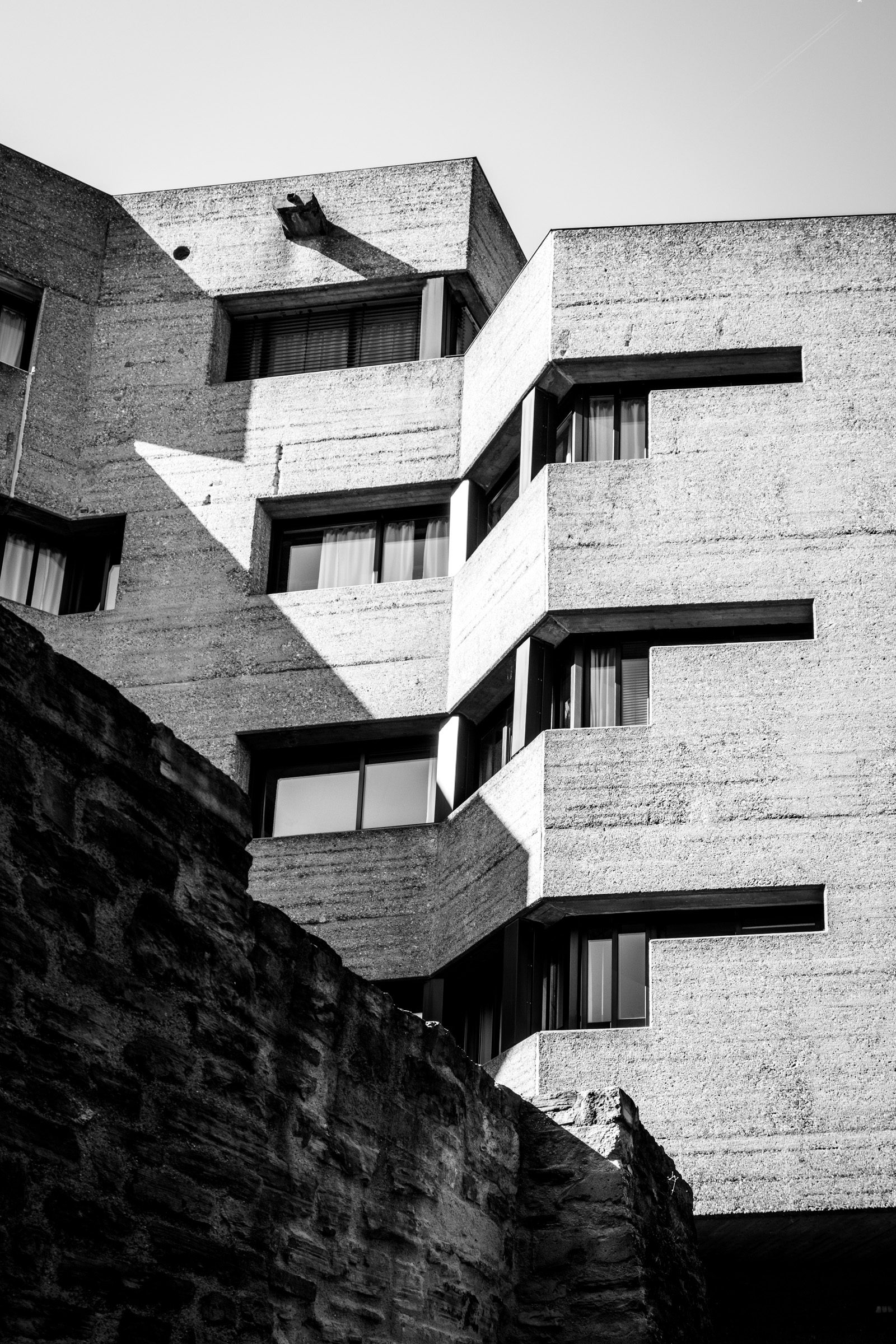 View of Rathaus Bensberg facade, castle wall visible below